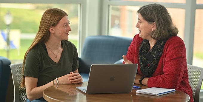 counselor conversing with student